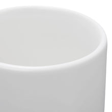 Glazed white stoneware mug rim and rounded body