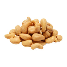 Whole cashews, light golden brown, piled nuts for snacking