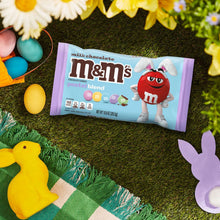 Pastel blend milk chocolate candy bag on grass with Easter egg decorations