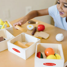 Wooden food groups play set with open crates and colorful food pieces