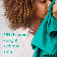 Fresh scent wash effect on white clothing near teal fabric
