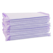 Stack of lavender cat litter box pads with folded edges