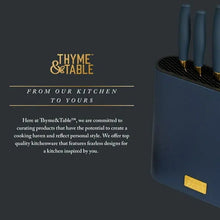 Dark-blue knife block with gold label and nearby knives with dark handles