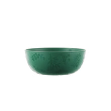 Green plastic serving bowl with etched holly motif