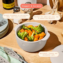 Porcini taupe covered casserole dish filled with broccoli and roasted vegetables