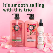 Rose hips shampoo trio with two pump bottles and a small bottle, pink rose branding