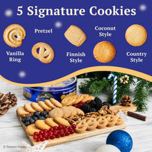 Tray of assorted signature butter cookies with a blue Royal Dansk tin
