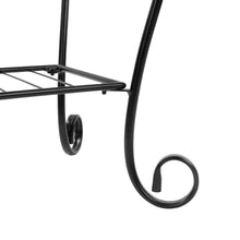 Black metal plant stand corner with curved foot and slatted shelf support bar.