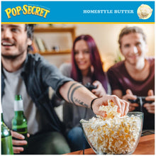 Homestyle butter popcorn being poured into a glass bowl on a table