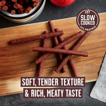 Beef dog treat sticks with slow cooked callout and soft, tender texture