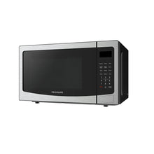 Frigidaire stainless steel countertop microwave oven 3/4 view with keypad and display window
