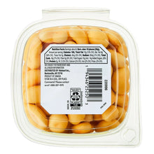 Plastic tub of Peach flavored yogurt covered cashews with barcode and nutrition panel