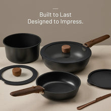 Black nonstick pots and pans set with wooden handles and matching lids