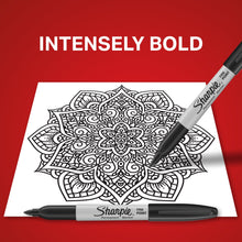 Black fine-point permanent marker on a paper mandala design.