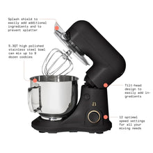 Black stand mixer with stainless bowl and whisk, flat beater, dough hook.
