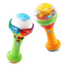 Colorful maracas toy set with green and orange handles and translucent rattle tops