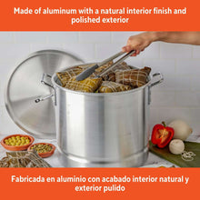 Aluminum steamer pot with domed lid and side handles, filled for steaming