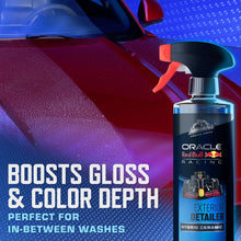 Exterior detail spray bottle on a car panel for boosted gloss and color depth
