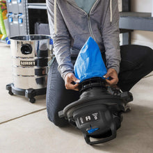 Wet/dry vacuum with detail tool and blue cloth attachment for cleaning