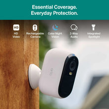 Outdoor wireless security camera mounted on wall with lens and side indicator light