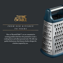 Stainless steel box grater with dark blue handle and black base