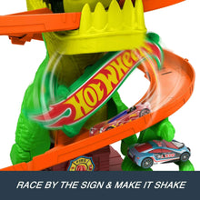 Green T-rex on orange track with built-in lane and toy car figures
