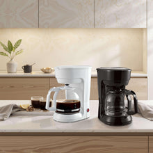 Black 12-cup drip coffee maker next to a white coffeemaker on countertop