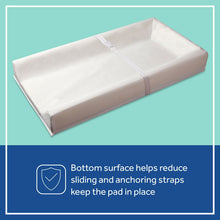 White contoured changing pad with anchor strap and textured nonslip underside