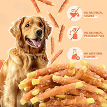 Chicken jerky wrapped pumpkin biscuit dog treats with yellow biscuit ends and twisted chews.