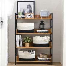 Woven storage baskets with cream sides and dark base, open tops on shelving