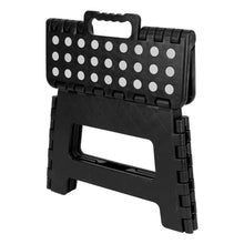 Black plastic foldable step stool with polka dot top and carry handle cutout