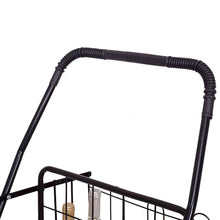 Black folding cart handle with ribbed grip and wire basket side rail.