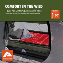 Rectangular sleeping bag inside open tent, gray top with red sleeping surface