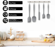 Gray silicone spatula set with safety and care icons