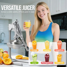 Manual juicer press on counter with person holding a glass of fruit juice