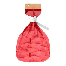 Red diaper disposal bag tied closed, shown filled with used diapers