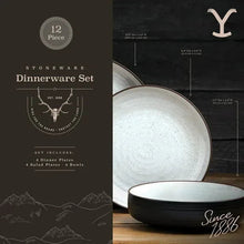 Stoneware dinnerware set pieces with white plates and black-rimmed edges