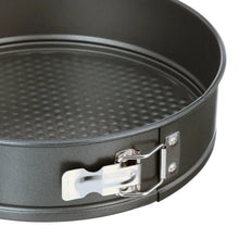 Round springform pan rim with dark nonstick coating and metal latch for removable bottom