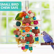 Hanging parrot chew toy with corn cob pieces, rattan ball, rope, and colorful wooden beads