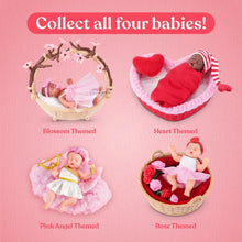 Set of four mini baby dolls in heart-shaped cradles with pink and red outfits
