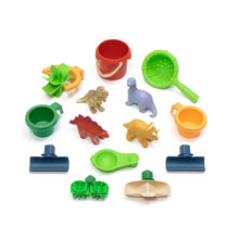Plastic dino water table accessories set with green tools, buckets, and animal figures