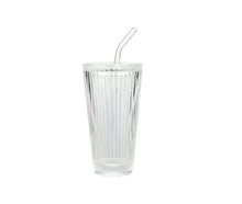 Clear ribbed glass tumbler with straw