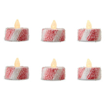 Six red-and-white candy striped flameless tealights with glowing LED flames