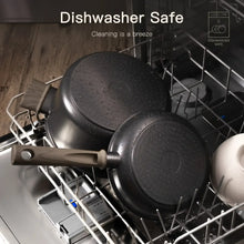 Black nonstick pots and pans in a dishwasher rack