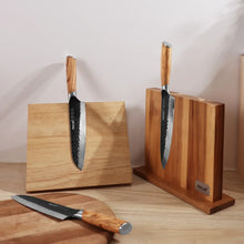 Wood-handled kitchen knife set on a wooden block