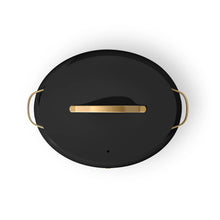 Black multi-cooker lid with gold handle bar, circular shape