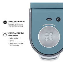 Teal single-serve coffee maker control panel with round K button