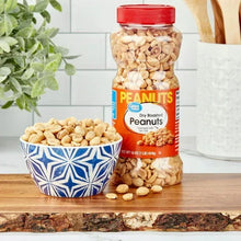 Dry roasted peanuts jar with red cap, label facing, filled with light beige peanuts