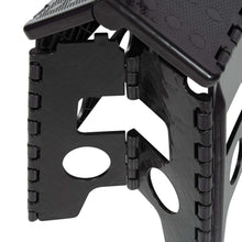 Black plastic folding step stool side view with molded hand grips and hinges