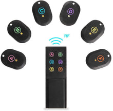 RF key locator set with six oval trackers marked A–F and a remote pad